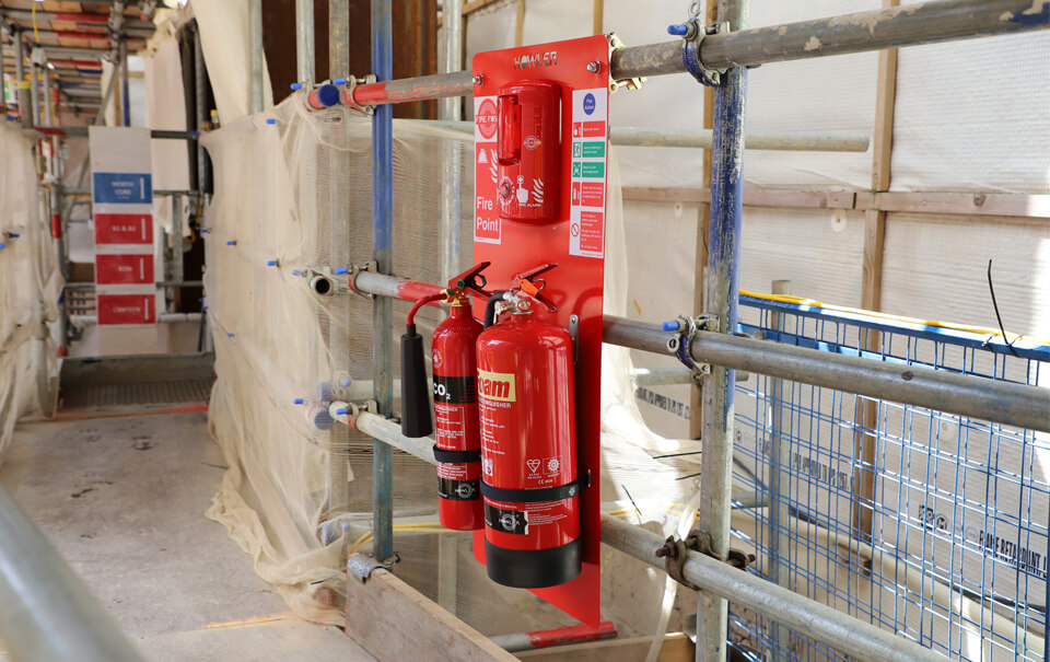 firepost on scaffolding with fire alarm and fire extinguisher