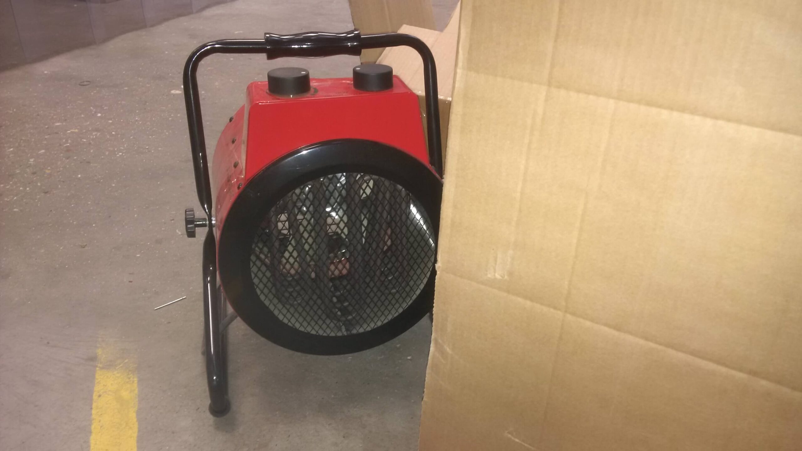 fan heater next to cardboard box